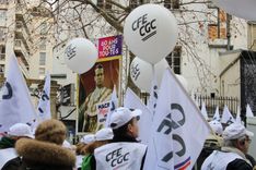 Workers' unions parade in the street.