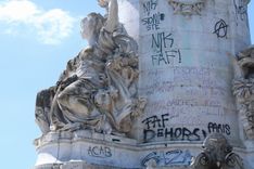 Graffiti tags on statues at the place de la République in central Paris.