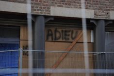 In Chaudfontaine, the row of houses bordering the Vesdre river features goodbye messages from residents, who have been forced to leave.