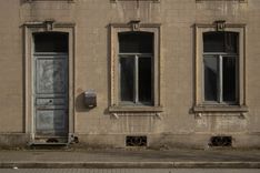 An abandoned house in Trooz. A sign on the second floor marks it as being for sale.
