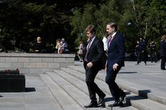 Participants of the Russian "Victory Day" parade visit the Soviet memorial in Tiergarten Park. Some wear St George's ribbons, which have been banned by Berlin authorities for the day.