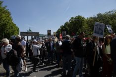 The "Victory Day" parade by Russians and Russo-German citizens on the main avenue of Tiergarten Park, behind the Brandenburg Gate.